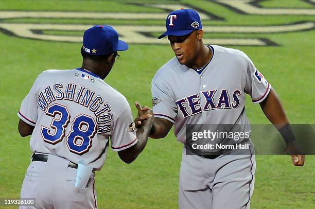 Manager Ron Washington of the American League shakes hands with American League All-Star Adrian Beltre of the Texas Rangers before the start of the...
