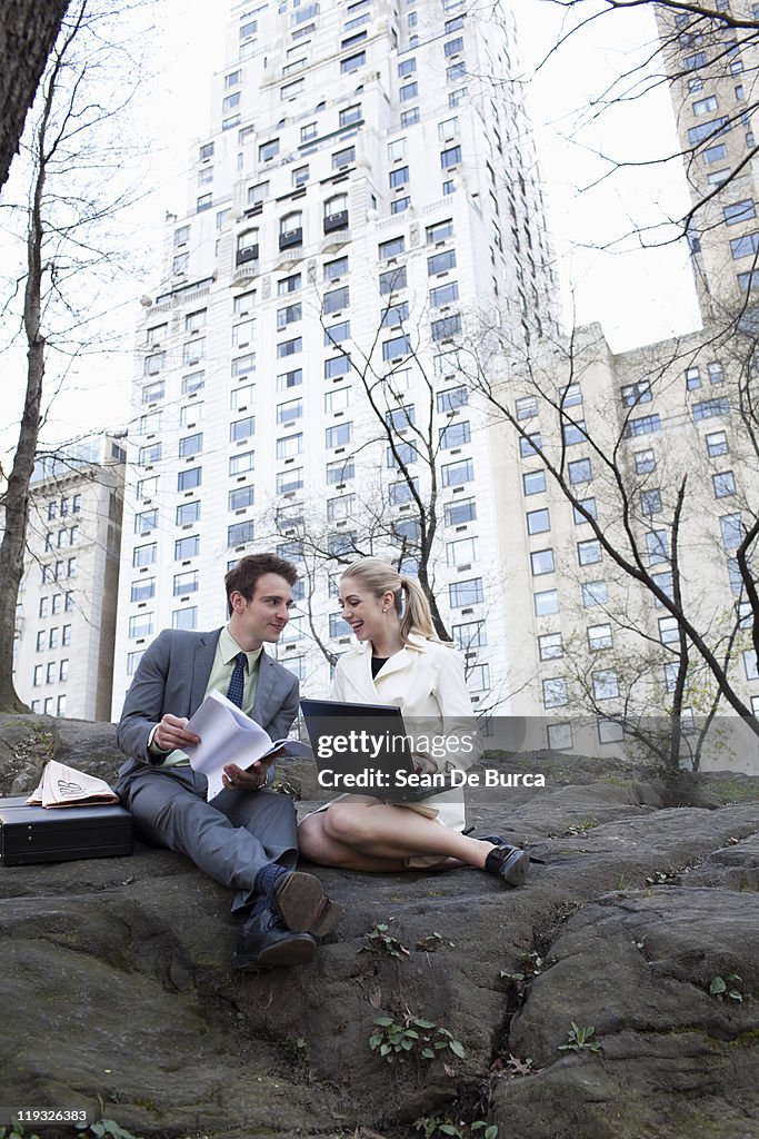 Young business couple in Central Park.