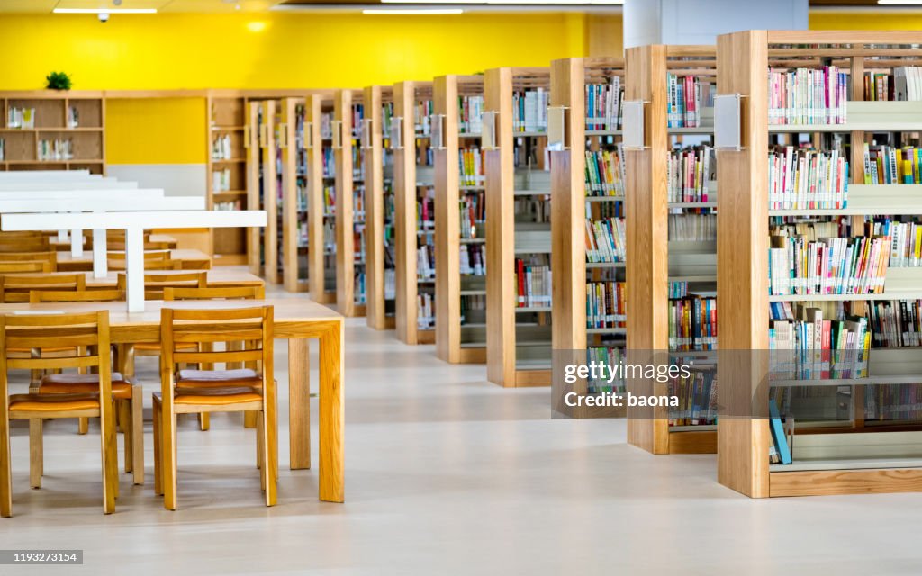 Empty wooden tables in public library
