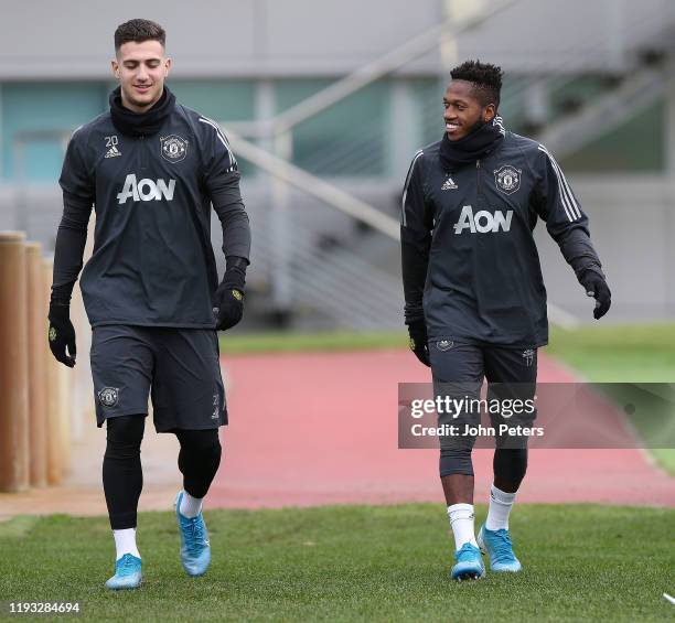 Diogo Dalot and Fred of Manchester United in action during a first team training session at Aon Training Complex on December 11, 2019 in Manchester,...