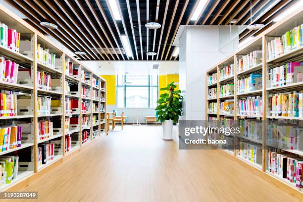 bookshelves in modern public library - floor perspective stock pictures, royalty-free photos & images