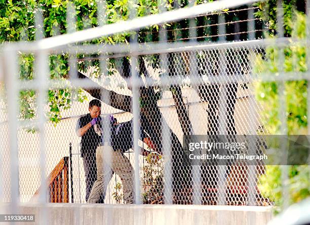 Law enforcement gather evidence outside Lauren Giddings apartment complex at 1058 Georgia Ave. Thursday morning. Giddings was last seen by friends...