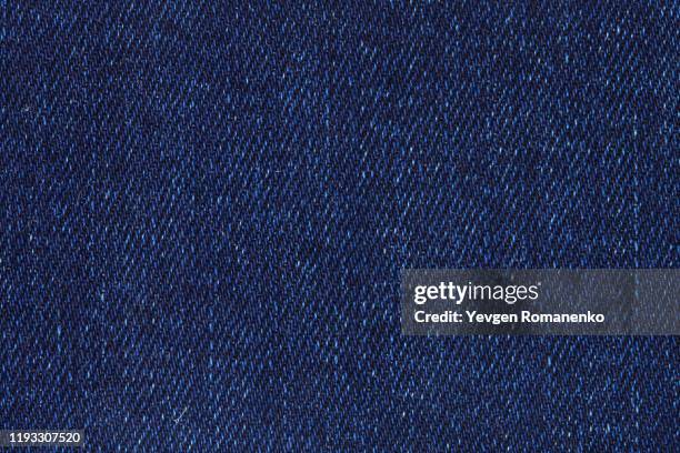 detail of blue jeans denim texture - spijkerstof stockfoto's en -beelden