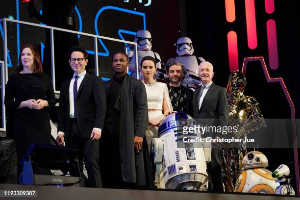 Katherine Kennedy, J.J. Abrams, John Boyega, Daisy Ridley, Oscar Isaac and Anthony Daniels with Star Wars characters Stormtroopers, Kylo Ren, R2-D2,...