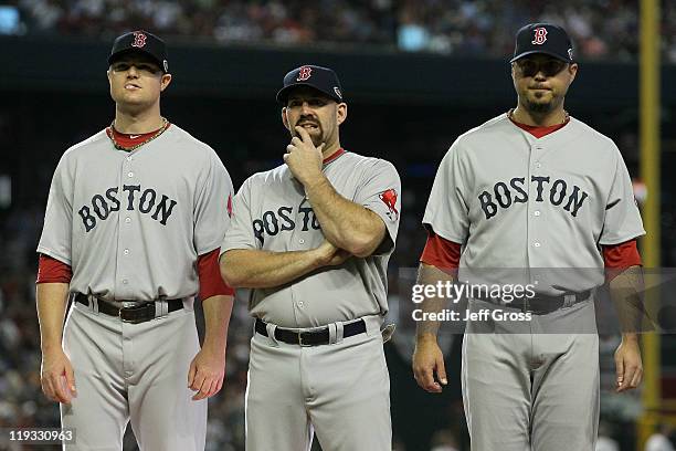 American League All-Star Jon Lester of the Boston Red Sox, stands with American League All-Star Kevin Youkilis of the Boston Red Sox and American...