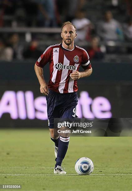 Simon Elliott of Chivas USA drives with the ball against the New York Red Bulls at The Home Depot Center on July 16, 2011 in Carson, California.