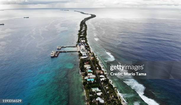 An aerial view of a strip of land between the Pacific Ocean and lagoon on November 25, 2019 in Funafuti, Tuvalu. The low-lying South Pacific island...