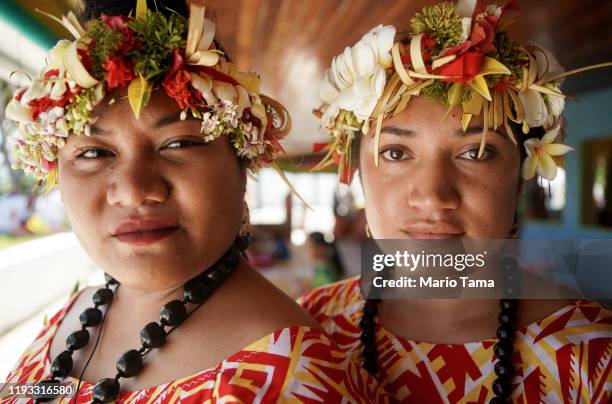 Faitau Teikausi and Pasepa Afele pose at a traditional community celebration on November 25, 2019 in Funafuti, Tuvalu. The low-lying South Pacific...