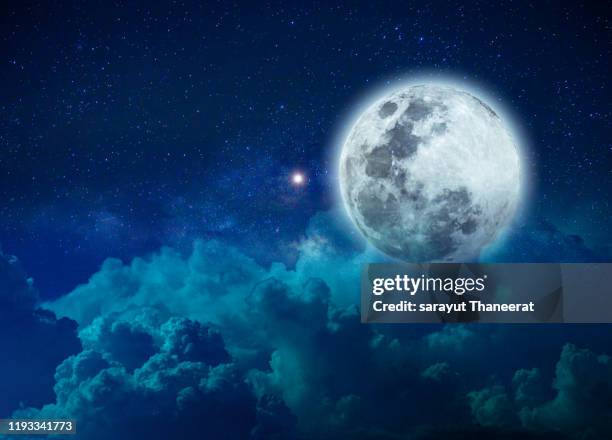 background night sky with stars moon and clouds blue sky - medias lunas fotografías e imágenes de stock