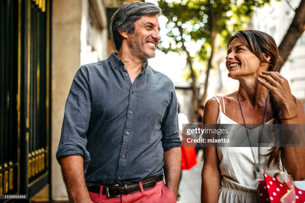 Smiling couple with style in shopping