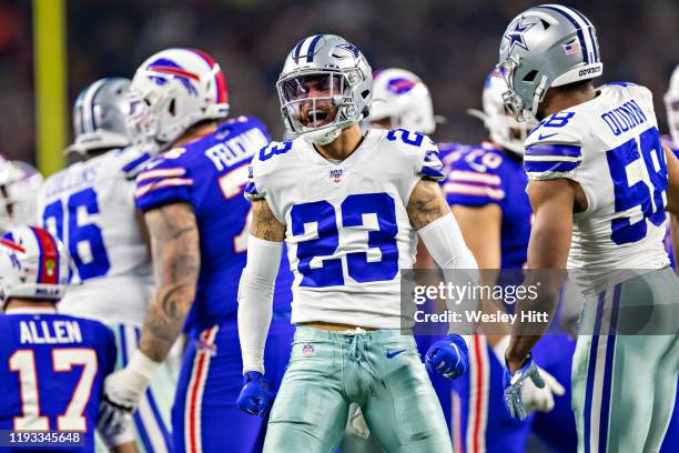 Darian Thompson of the Dallas Cowboys celebrates after sacking Josh Allen of the Buffalo Bills during the first half of a game on Thanksgiving Day at...