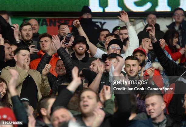 Sheffield United player Oli McBurnie stands in amongst the Swansea City fans prior to kick off during the Sky Bet Championship match between Cardiff...