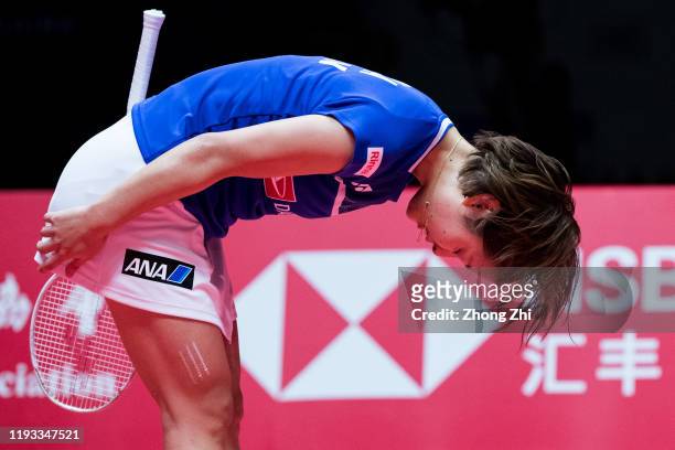 Nozomi Okuhara of Japan celebrates winning over the match against Tai Tzu Ying of Chinese Taipei on day 1 of the HSBC BWF World Tour Finals 2019 at...