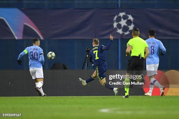 Dani Olmo of GNK Dinamo Zagreb scores his team's first goal past Nicolas Otamendi of Manchester City during the UEFA Champions League group C match...