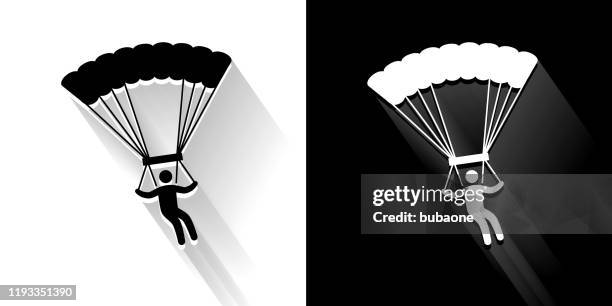 parachuting black and white icon with long shadow - sky diving white background stock illustrations