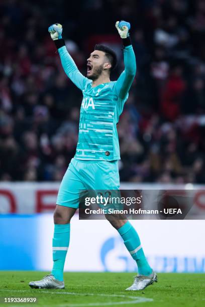 Goalkeeper Paulo Gazzaniga of Tottenham celebrates his team's first goal during the UEFA Champions League group B match between Bayern Muenchen and...
