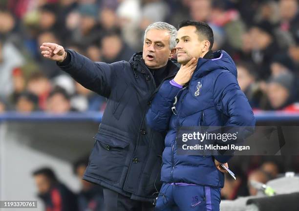 Jose Mourinho, Manager of Tottenham Hotspur speaks with Assistant Coach Joao Sacramento during the UEFA Champions League group B match between Bayern...