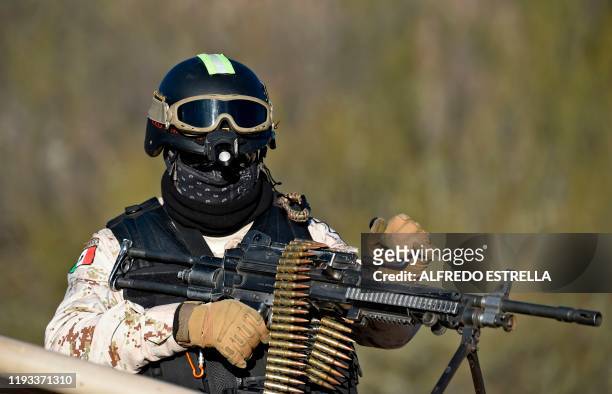 Member of the National Guard keeps watch at La Mora ranch, in Bavispe, Sonora State, Mexico, on January 12, 2020 where Mexican President Andres...