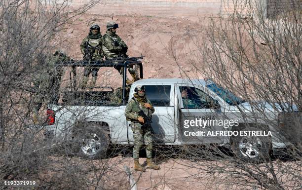 Members of the Navy keep watch at La Mora ranch, in Bavispe, Sonora State, Mexico, as Mexican President Andres Manuel Lopez Obrador holds a meeting...