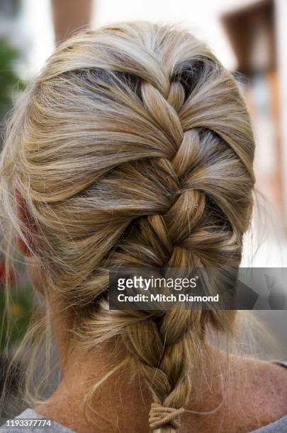 french  braid hairstyle on woman - thick white women fotografías e imágenes de stock