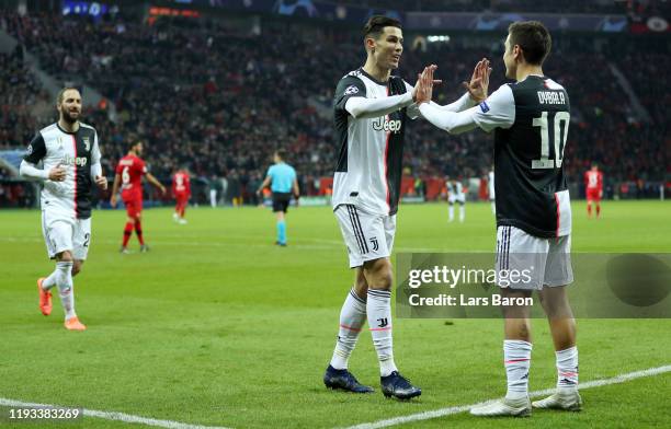 Cristiano Ronaldo of Juventus celebrates after scoring his team's first goal with Paulo Dybala of Juventus during the UEFA Champions League group D...