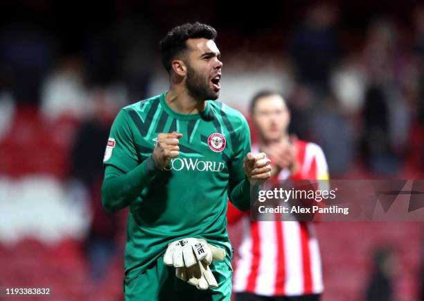 David Raya of Brentford celebrates victory during the Sky Bet Championship match between Brentford and Cardiff City at Griffin Park on December 11,...