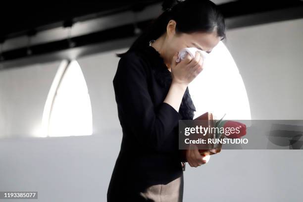 sadness bereaved mourning at funeral - japanese funeral stock pictures, royalty-free photos & images