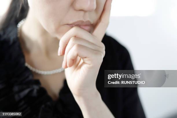 sadness bereaved mourning at funeral - japanese funeral stock pictures, royalty-free photos & images