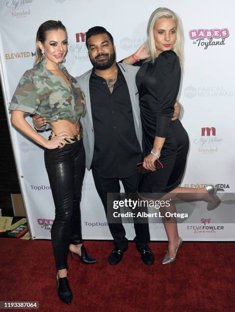 Savannah Lynx, Adrian Dev and Kristi Tucker arrive for Babes In Toyland Los Angeles Toy Drive held at Avalon on December 4, 2019 in Hollywood,...