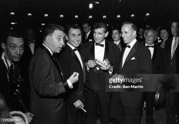 Earl Wilson, Arthur Laurents, Leonard Bernstein,Jerome Robbins outside Sardi's opening night of West Side Story, 26th September 1957.