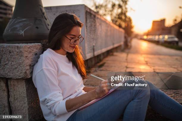 carefree student drawing - beautiful college girls stock pictures, royalty-free photos & images