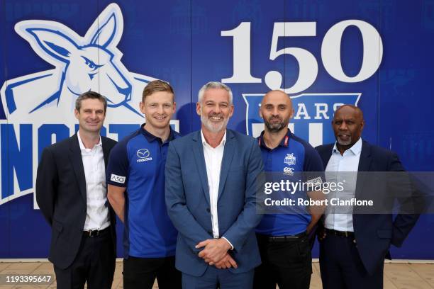 Football, Brady Rawlings, captain Jack Zeibell, North Melbourne chairman, Ben Buckley, coach Rhyce Shaw and CEO, Ben Amarfio pose during a North...