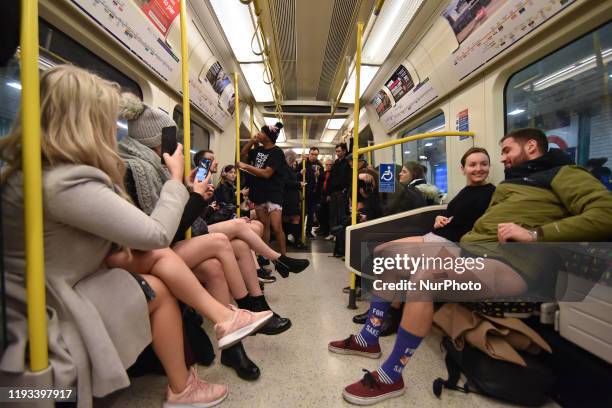 People ride the London Underground without trousers as they attend the 11th No Trousers Tube Ride on January 12, 2020 in London, England. Originating...