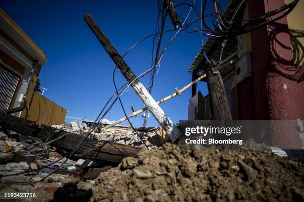 Rubble and destroyed power lines sit on the ground in Guayanilla, Puerto Rico, on Sunday, Jan. 12, 2020. Puerto Rico was hit by a series of...