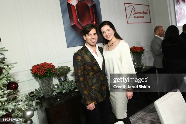 Michael Arguello and Julia Foster attend Roric Tobin's Holiday Dining Room For Luxury Living at Luxury Living Showroom on December 11, 2019 in New...