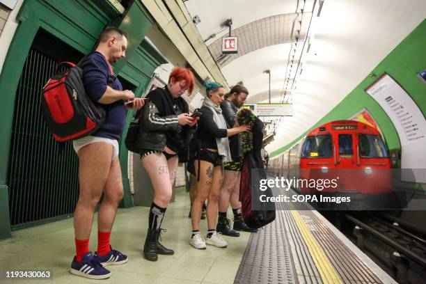 People without trousers ride on the Circle Line as they take part during the 11th 'No Trousers Tube Ride' event on the London underground. The No...