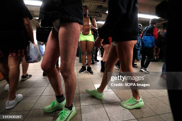 Group of riders with no pants are seen in the subway. As a part of a comedic stunt in 2002 seven riders took their first "No Pants Subway Ride" in...