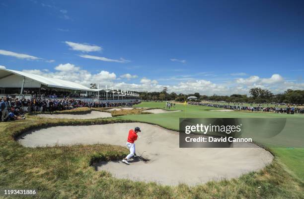 Xander Schauffele of the United States team plays his third shot on the 16th hole in his match with Patick Cantlay against Adam Hadwin and Sungjae Im...