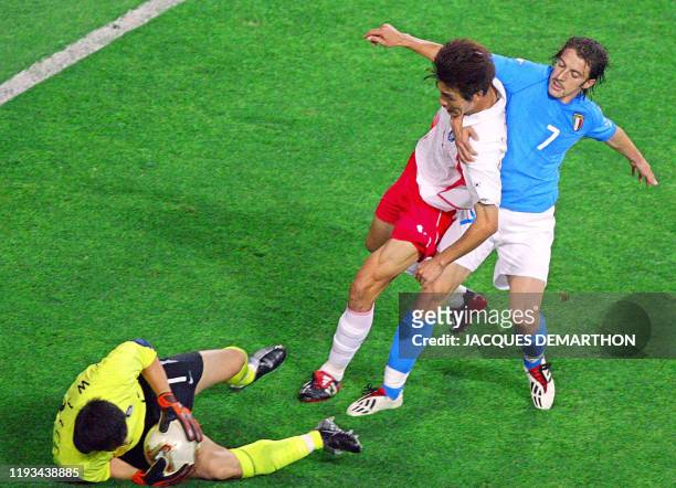 South Korean goalkeeper Lee Woon-jae makes a save as South Korean forward Seol Ki-hyeon fights off Italian forward Alessandro Del Piero in their...
