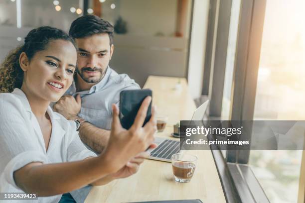 young portrait creative couple working success project with business partner and wearing  casual outfit working happy action in modern coworking space - islamic finance stock pictures, royalty-free photos & images