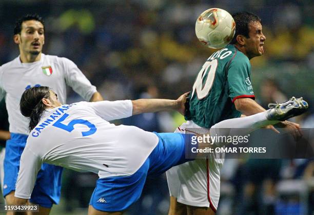 Mexico's forward Cuauhtemoc Blanco grimaces as Italy's defender Fabio Cannavaro picks up the ball on his heel during match 43 group G of the 2002...