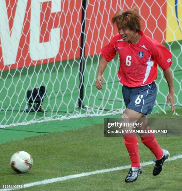 South Korea's Yoo Sang Chul runs past the ball he put in the back of the net after scoring against Poland in the 53rd minute, 04 June 2002 at the...