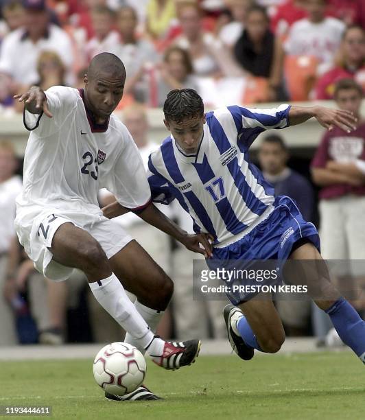 Midfielder Eddie Pope battles Honduran defender Ivan Guerrero for the ball 01 September, 2001 during the 2002 FIFA World Cup Korea-Japan qualifier...