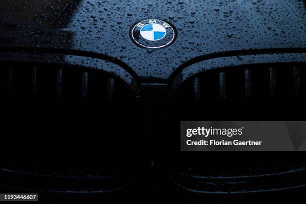The emblem of BMW is pictured on a wet engine bonnet on January 09, 2020 in Berlin, Germany.