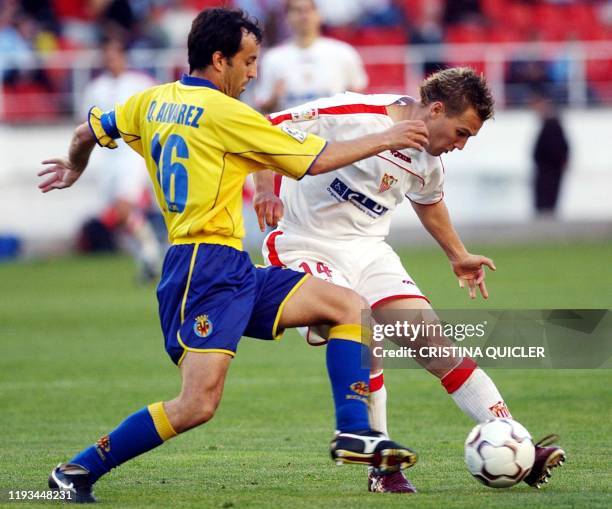 Sevilles player antoñito fights for the ball with villarreals quique alvarez player during a Sevilles player antoñito fights for the ball with villarreals quique alvarez player during a