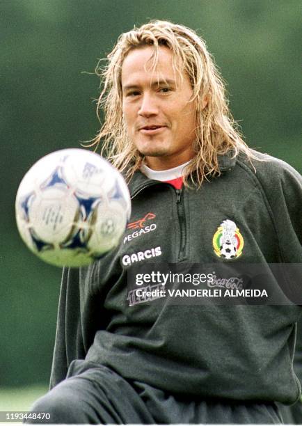 Mexican soccer star Luis Hernandez heads a ball during a training