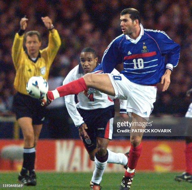 French midfielder Zinedine Zidane fights for the ball with England's Paul Ince 10 February at Wembley stadium in London in a friendly between England...