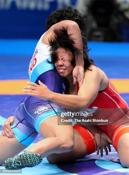 Yuzuka Inagaki of Japan and Pooja Dhanda of India compete in the Women's 59kg quarter final on day five of the World Wrestling Championships at the...