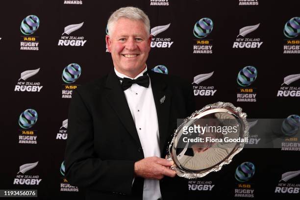 Steinlarger Salver for an Outstanding Contribution to New Zealand Rugby recipient Steve Tew poses for a photograph during the New Zealand Rugby...