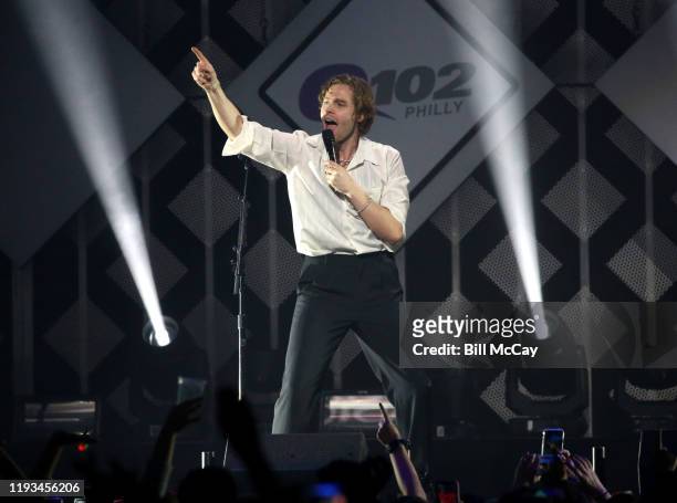 Luke Hemmings and Ashton Irwin of '5 Seconds of Summer' perform onstage during Q102's Jingle Ball 2019 Presented by Capital One at Wells Fargo Center...